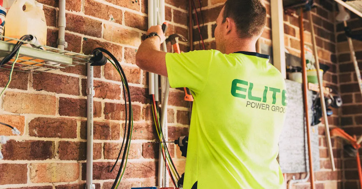 An electrician mounting a wall-mounted home solar battery storage unit indoors during an installation